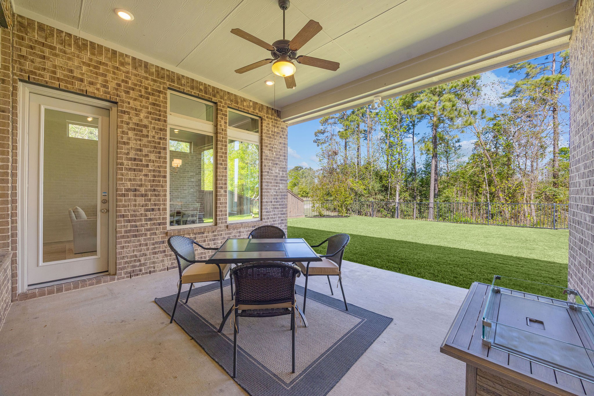 13103 Six Rivers Drive Humble, TX 77346 - Photo 26 of 44 The covered backyard patio offers generous space for outdoor entertaining while enjoying peaceful views.