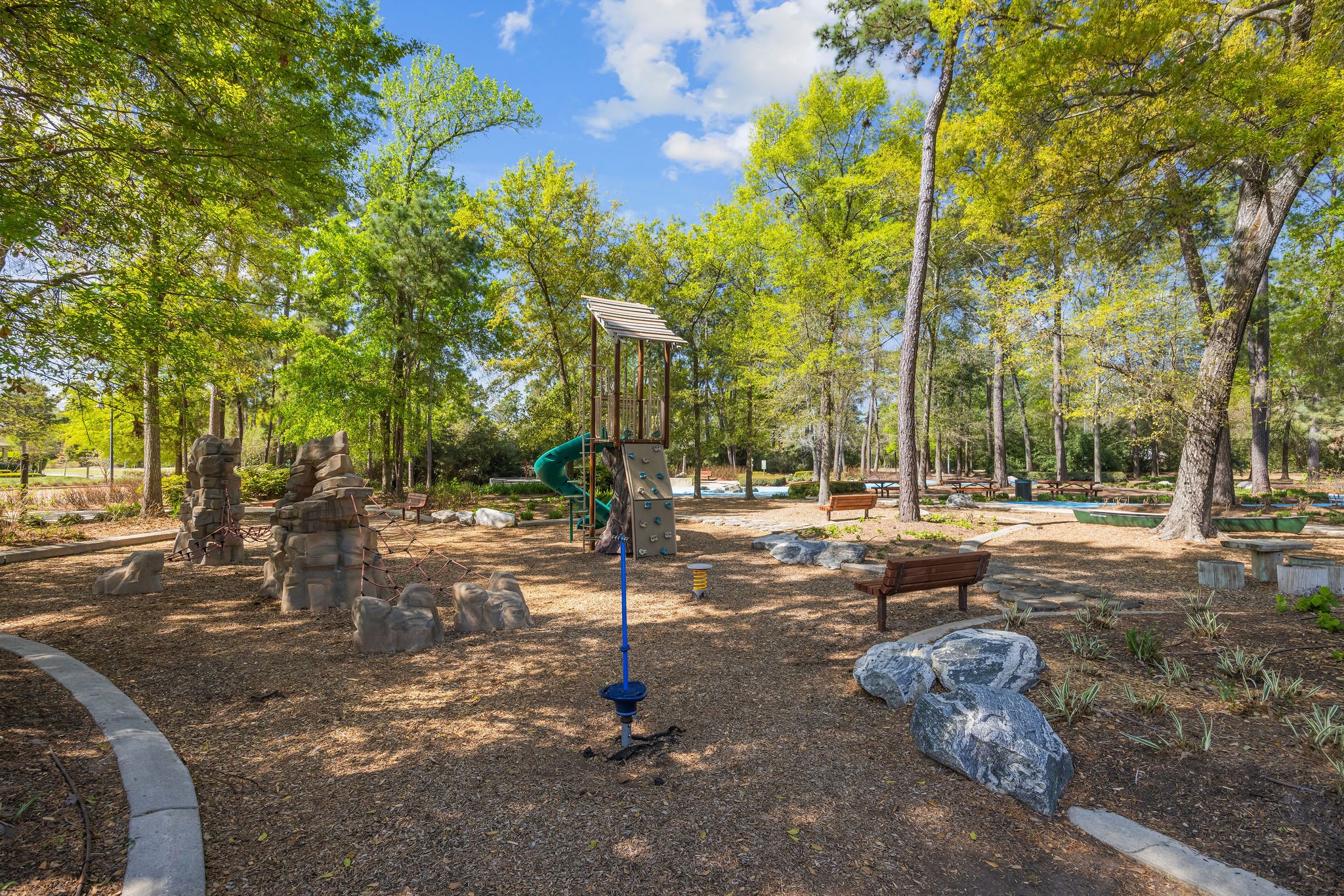 13103 Six Rivers Drive Humble, TX 77346 - Photo 37 of 44 The Groves offers an array of amenities including scenic trails, parks, playgrounds, a resort style pool and splash pad, clubhouse, fitness center, basketball court, soccer field, stocked pond, and picnic areas.