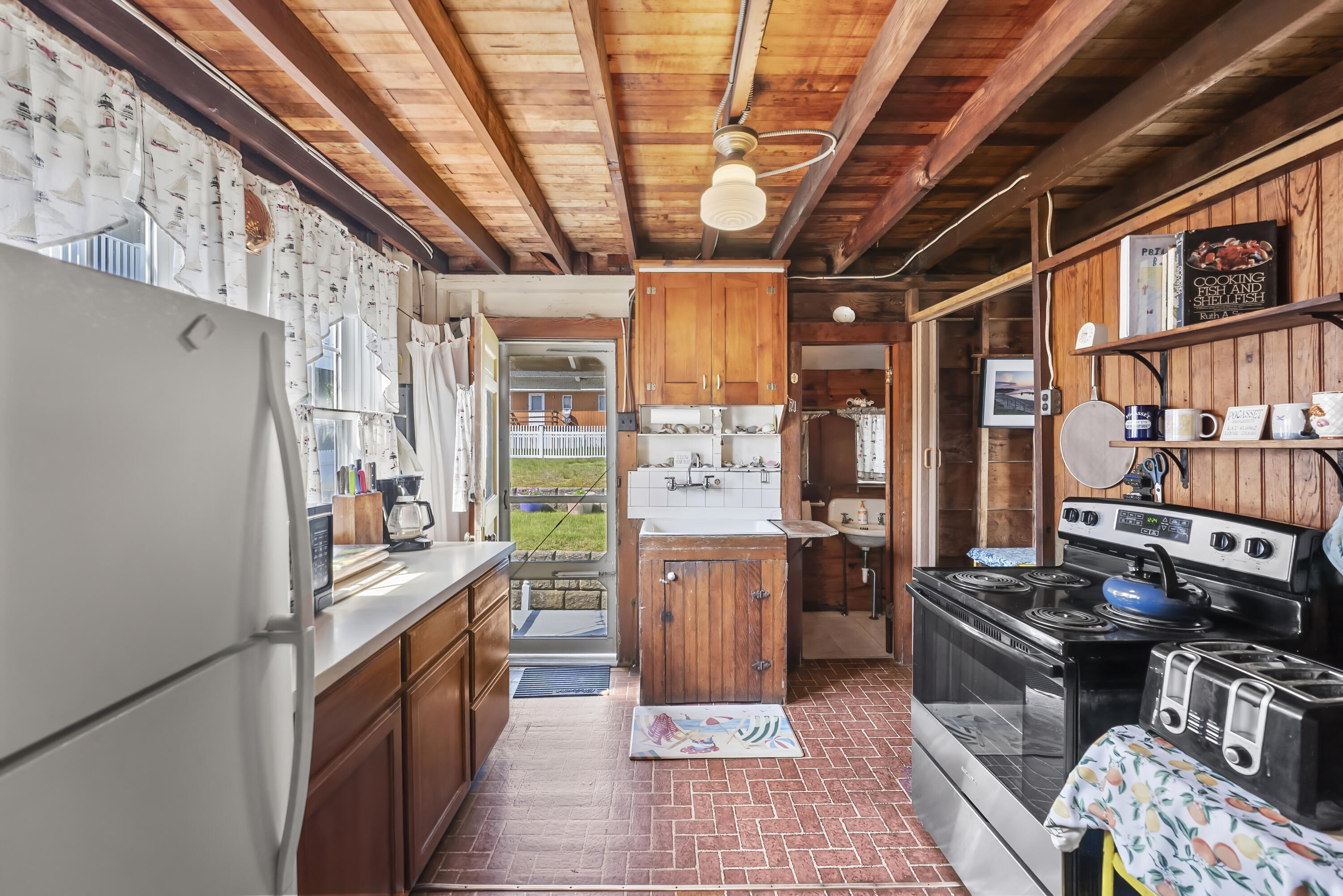 5 Spurr Road Pocasset, MA 02559 - Photo 11 of 42 a kitchen with stainless steel appliances granite countertop a refrigerator a stove and a sink with dishwasher