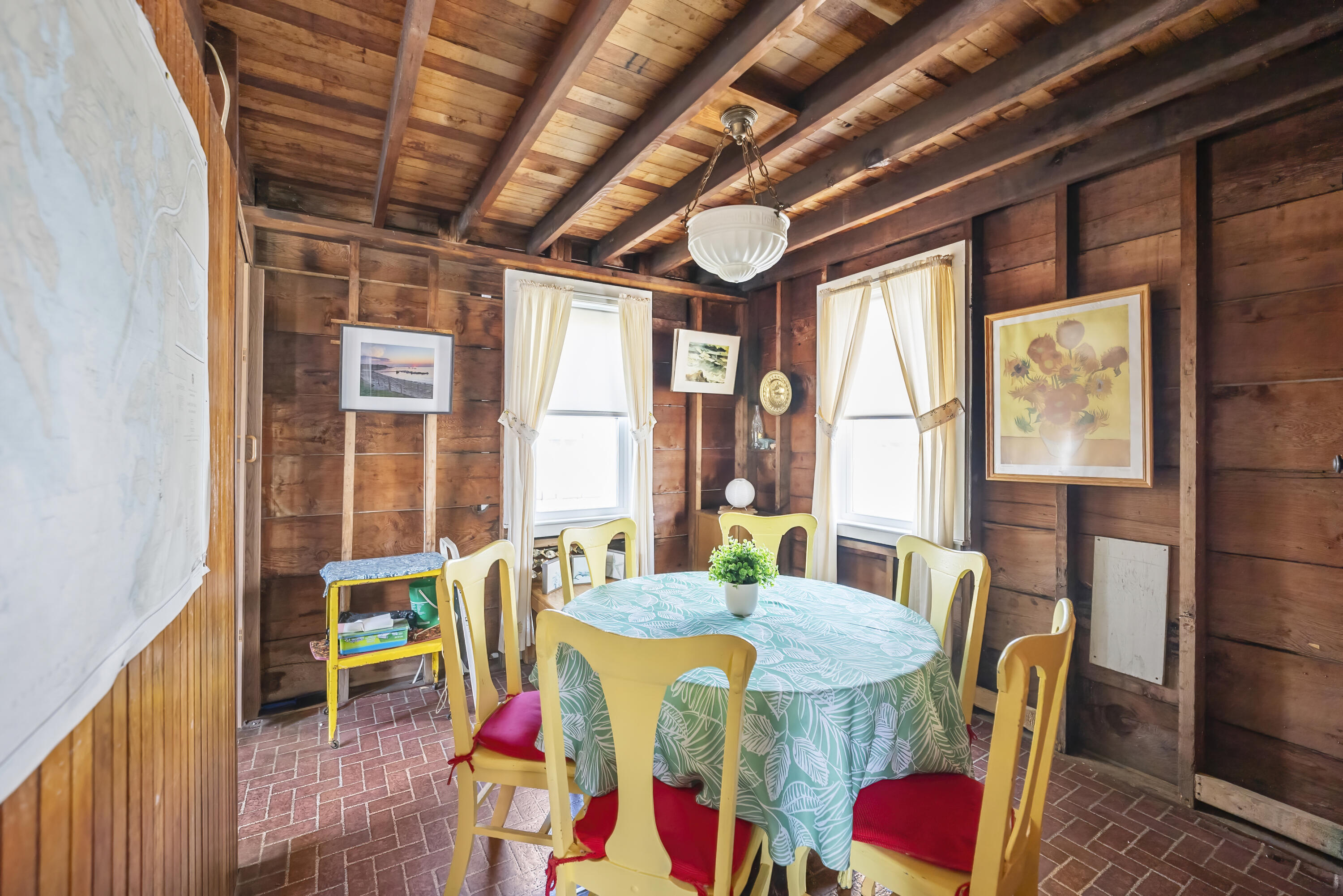 5 Spurr Road Pocasset, MA 02559 - Photo 14 of 42 a dining room with furniture large windows and wooden floor