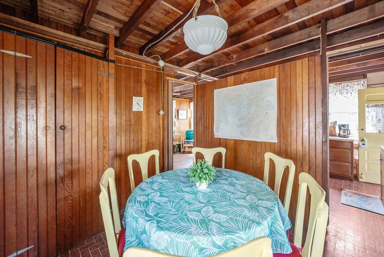 5 Spurr Road Pocasset, MA 02559 - Photo 15 of 42 a view of a dining room with furniture window and wooden floor