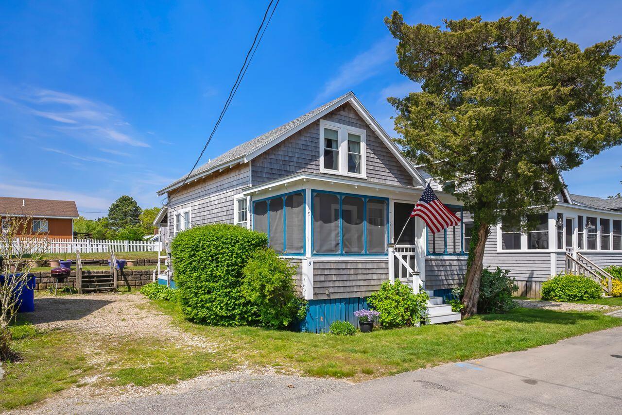 5 Spurr Road Pocasset, MA 02559 - Photo 39 of 42 a front view of a house with a yard