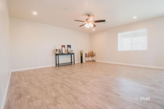 1113 Mayo Street Ridgecrest, CA 93555 - Photo 7 of 31 a view of a livingroom with a ceiling fan and window