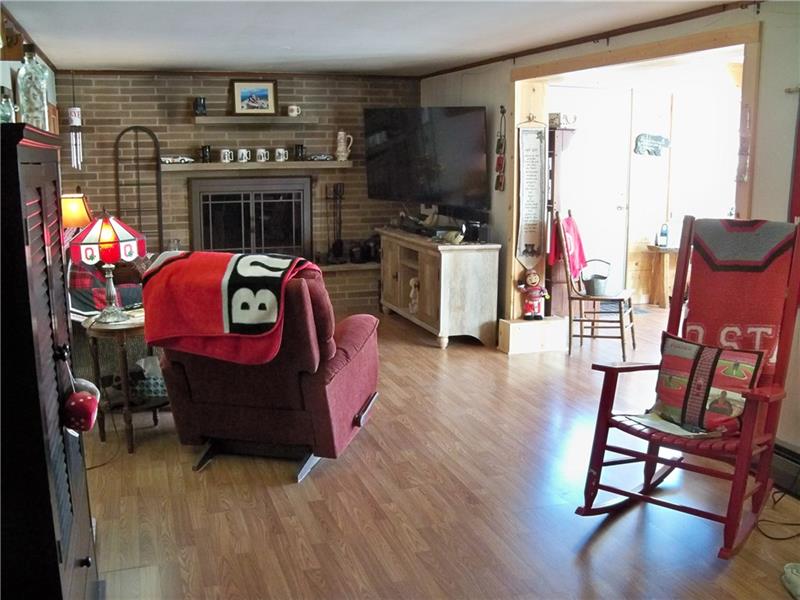 236 Center Church Road Grove City, PA 16127 - Photo 17 of 25 25x11 family room with wood burning fireplace.