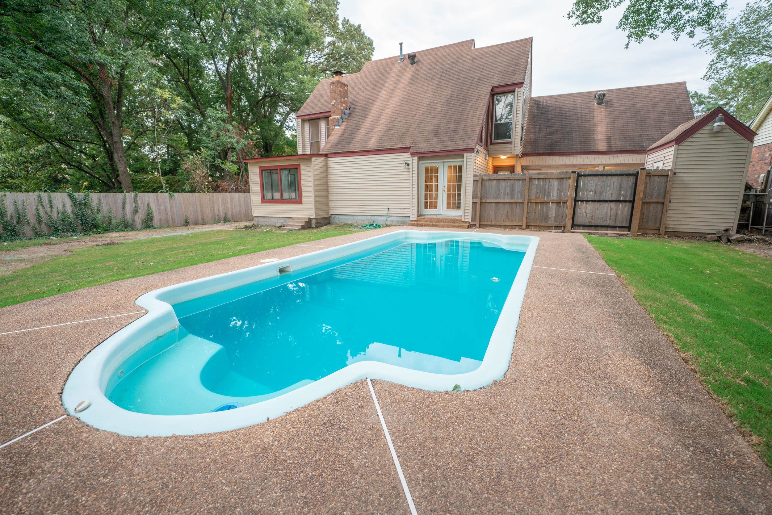 3054 Altruria Road Bartlett, TN 38134 - Photo 1 of 22 a view of a house with a swimming pool and a yard