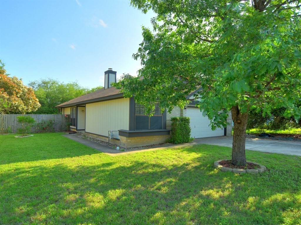 806 Sunny Lane Cedar Park, TX 78613 - Photo 1 of 1 a view of a yard with a house and a large tree