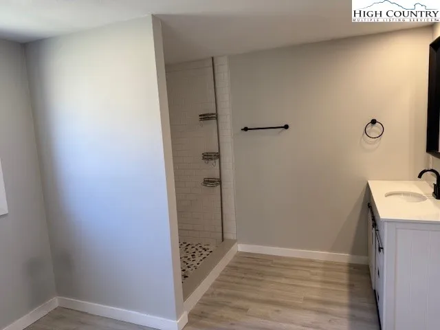 a view of a bathroom with sink and mirror