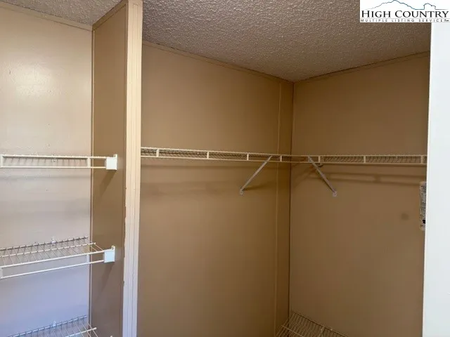 a view of a room with racks on the wall