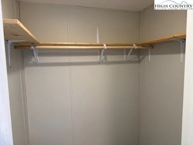 a view of an empty walk in closet