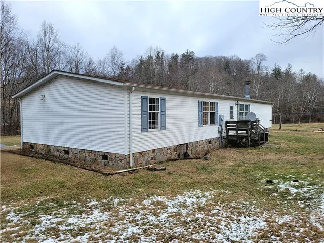 a view of a car park in front of a house