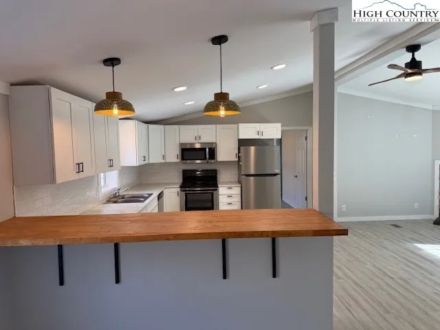 a room with furniture and a chandelier