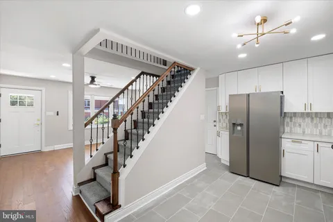 a view of entryway with kitchen and a window