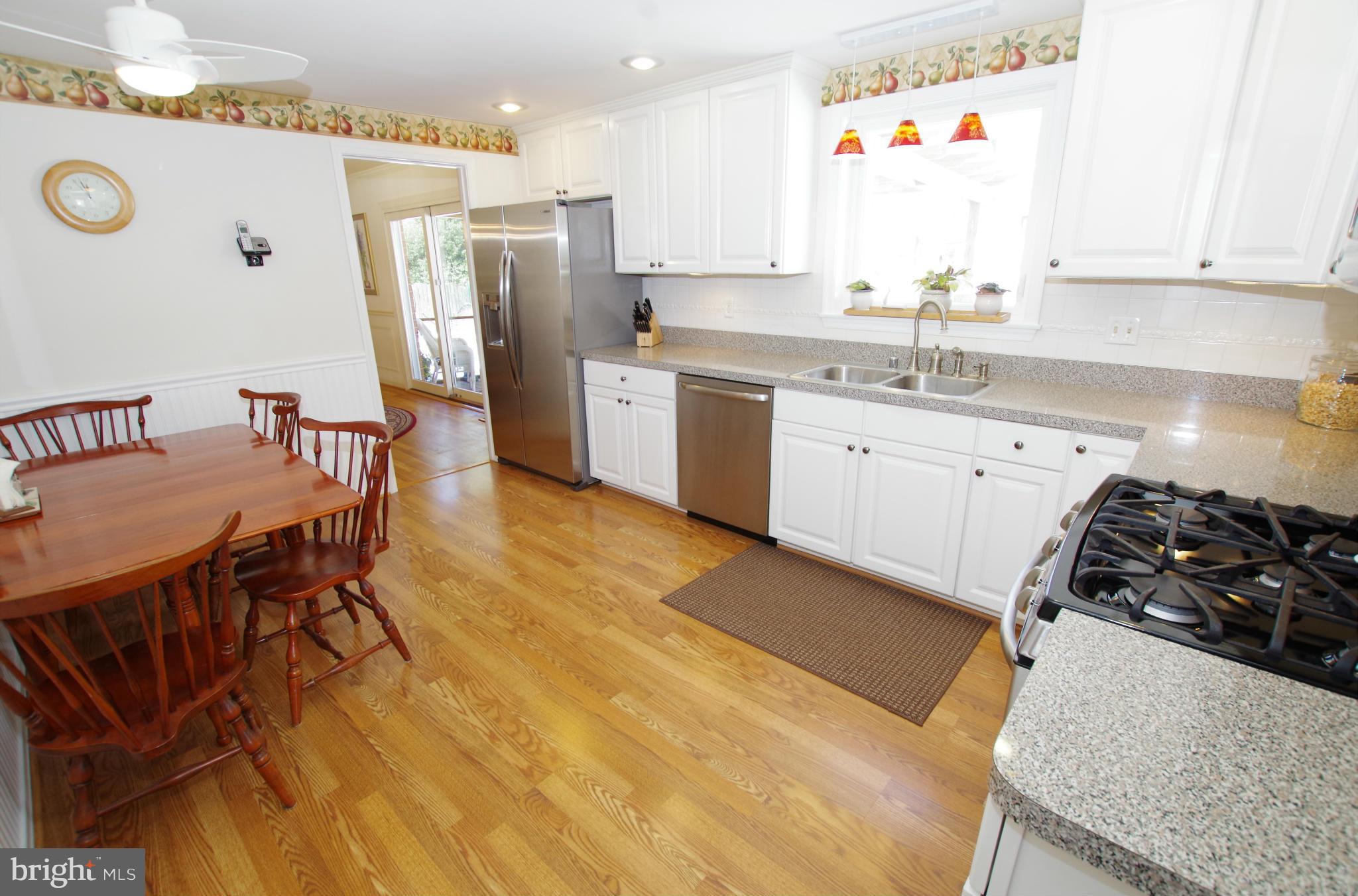 4121 Sir Walter Road Olney, MD 20832 - Photo 13 of 30 White Cabinets and Stainless Steel Appliances