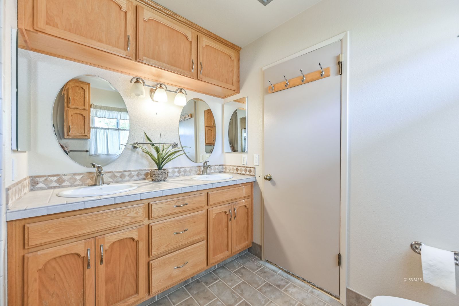 131 Chambers Street Ridgecrest, CA 93555 - Photo 17 of 28 a bathroom with a granite countertop double vanity sink and a mirror