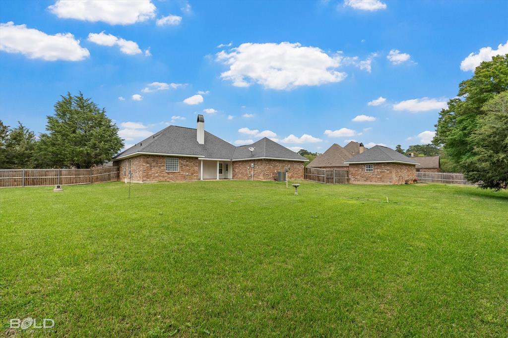 129 Wax Wing Drive Stonewall, LA 71078 - Photo 11 of 40 a front view of a house with garden