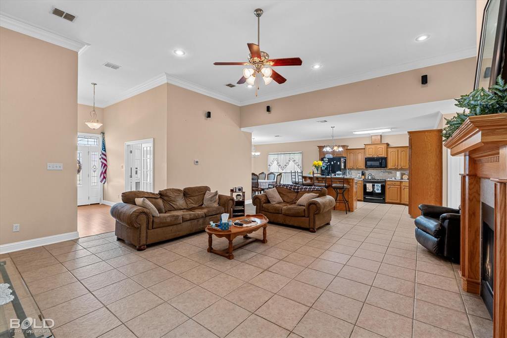 129 Wax Wing Drive Stonewall, LA 71078 - Photo 19 of 40 a living room with furniture and a chandelier