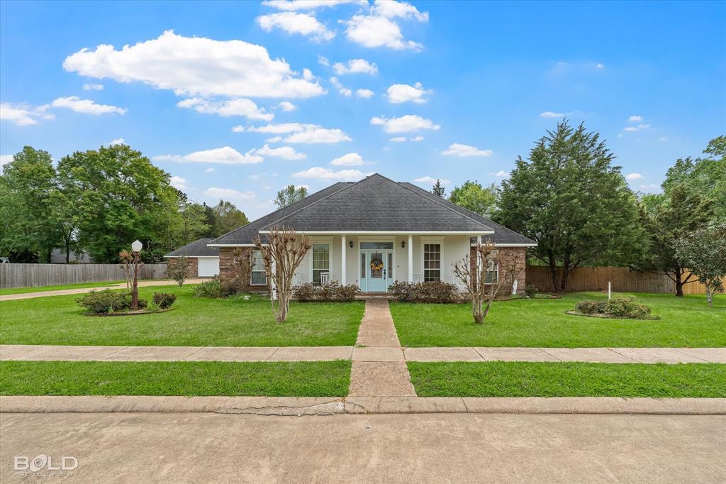 129 Wax Wing Drive Stonewall, LA 71078 - Photo 2 of 40 a view of a house with a big yard plants and large trees