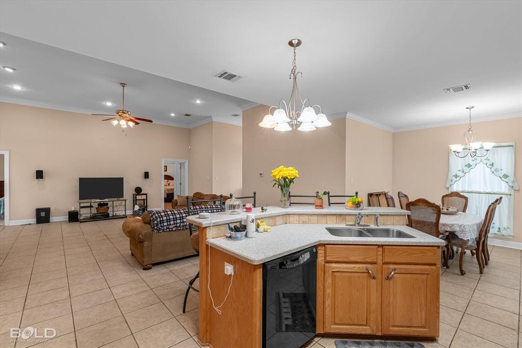 129 Wax Wing Drive Stonewall, LA 71078 - Photo 22 of 40 a kitchen with a counter space a sink appliances and cabinets