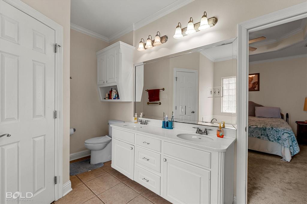 129 Wax Wing Drive Stonewall, LA 71078 - Photo 38 of 40 a spacious bathroom with a double vanity sink mirror and toilet