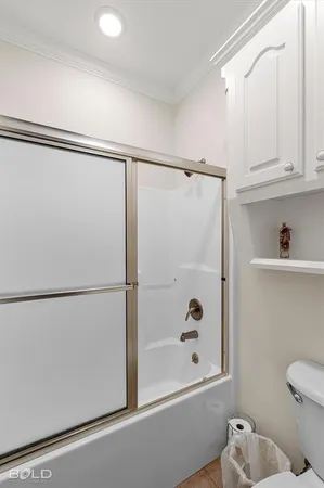 a bathroom with a shower and a toilet
