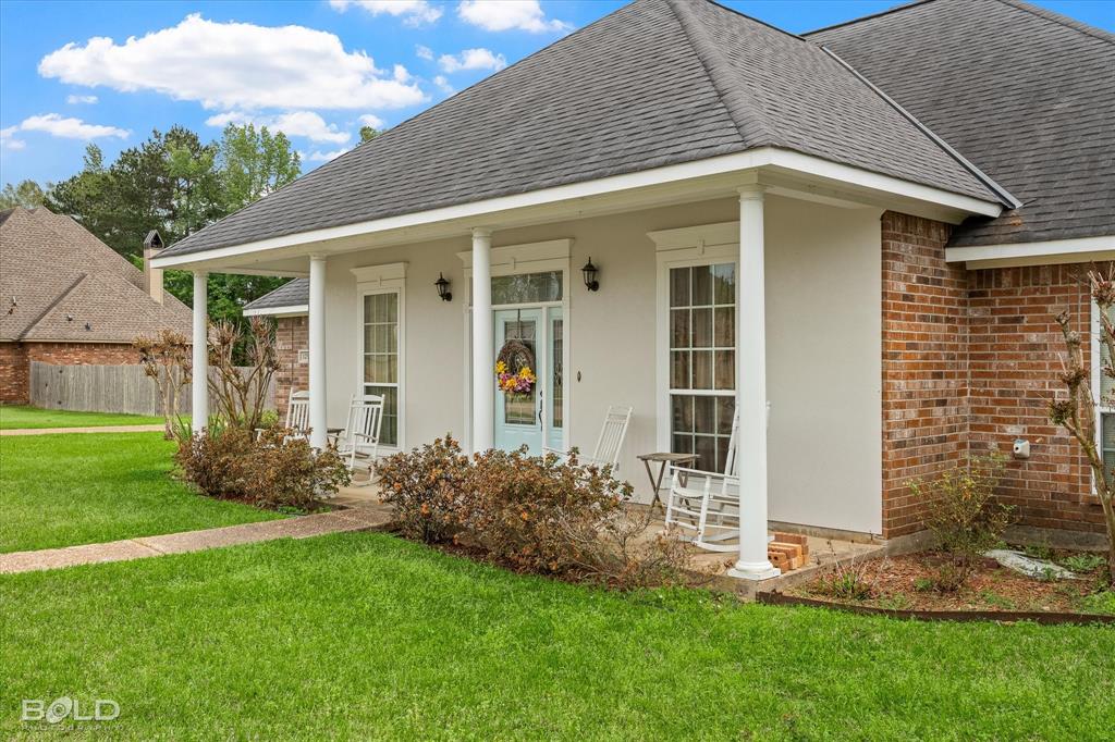 129 Wax Wing Drive Stonewall, LA 71078 - Photo 4 of 40 a front view of a house with a garden