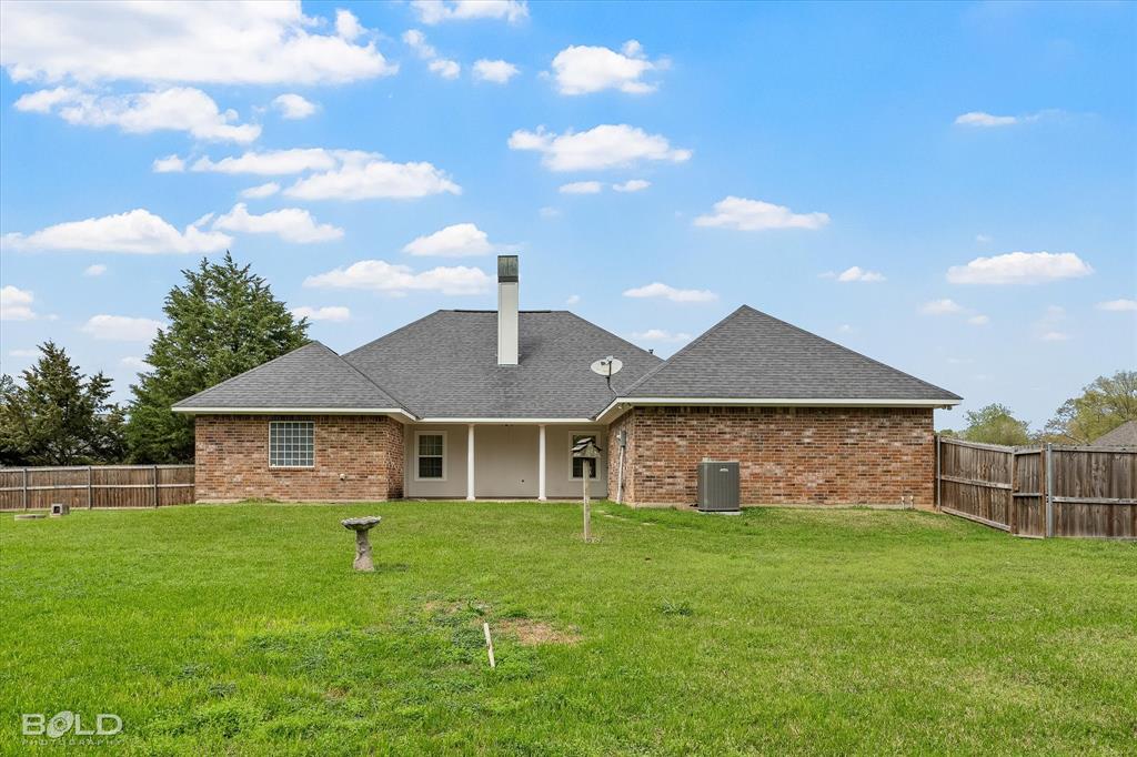 129 Wax Wing Drive Stonewall, LA 71078 - Photo 8 of 40 a front view of a house with a garden
