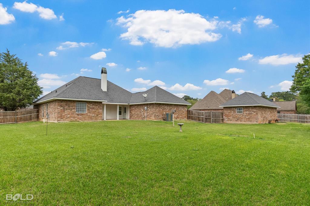 129 Wax Wing Drive Stonewall, LA 71078 - Photo 9 of 40 a view of a house with a yard and a tree