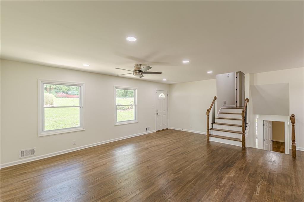3275 Clifton Church Road Southeast Atlanta, GA 30316 - Photo 14 of 59 an empty room with wooden floors and window