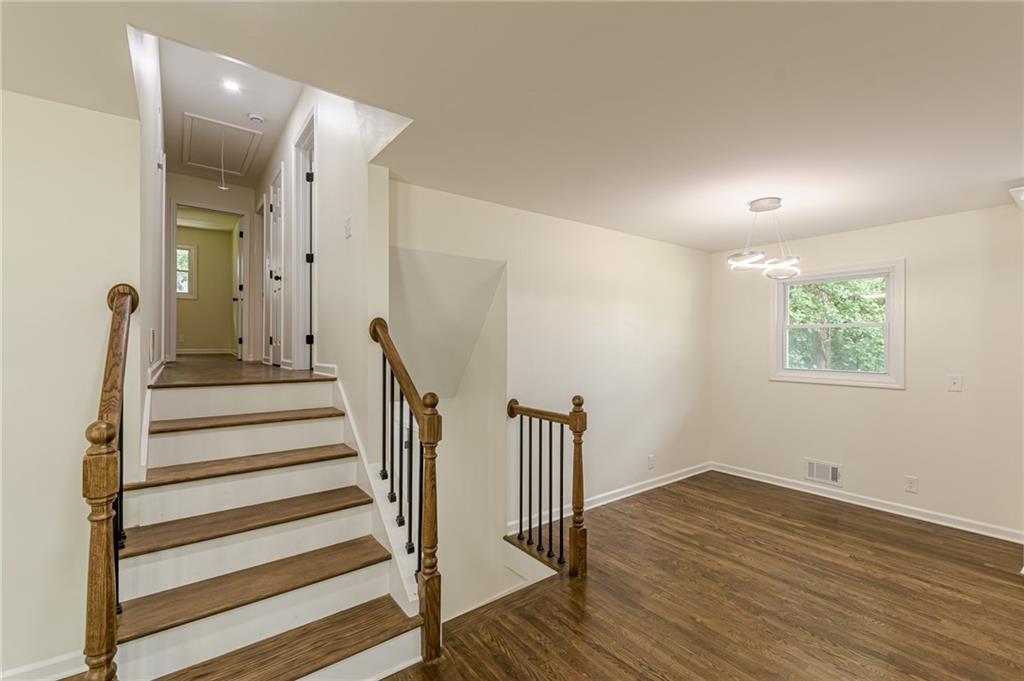 3275 Clifton Church Road Southeast Atlanta, GA 30316 - Photo 23 of 59 a view of a hallway with wooden floor and stairs