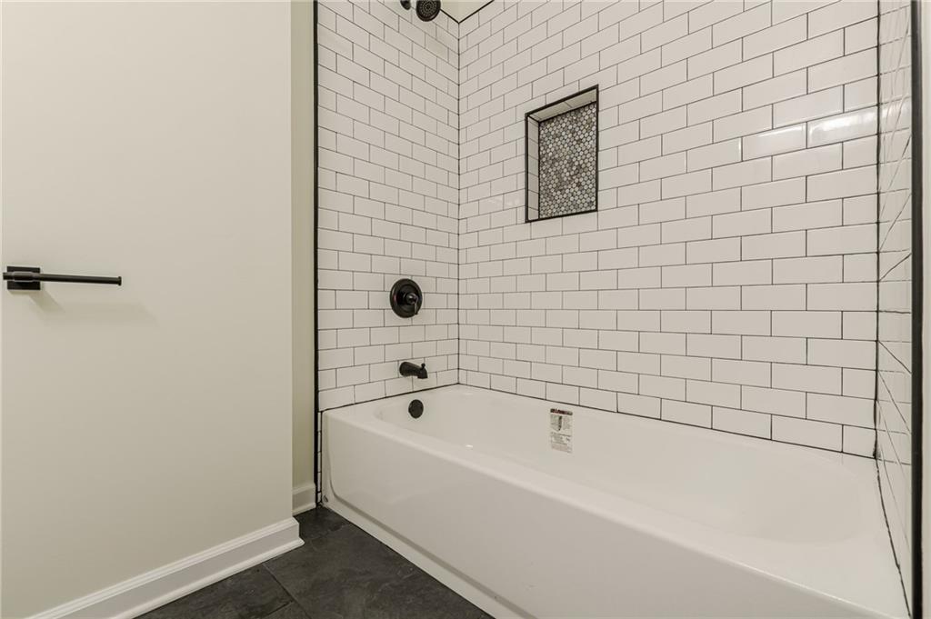 3275 Clifton Church Road Southeast Atlanta, GA 30316 - Photo 27 of 59 a bathroom with a bathtub
