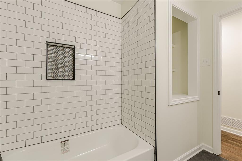 3275 Clifton Church Road Southeast Atlanta, GA 30316 - Photo 28 of 59 a bathroom with a bathtub
