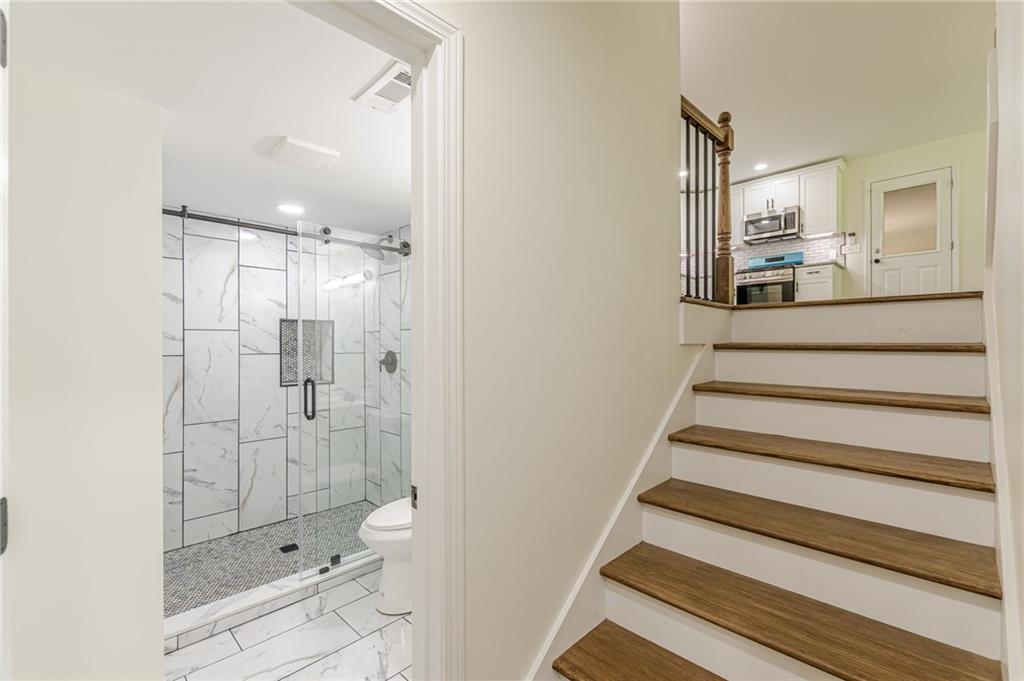 3275 Clifton Church Road Southeast Atlanta, GA 30316 - Photo 45 of 59 a bathroom with a shower and toilet
