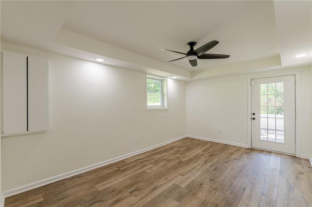 3275 Clifton Church Road Southeast Atlanta, GA 30316 - Photo 47 of 59 wooden floor in an empty room with a window