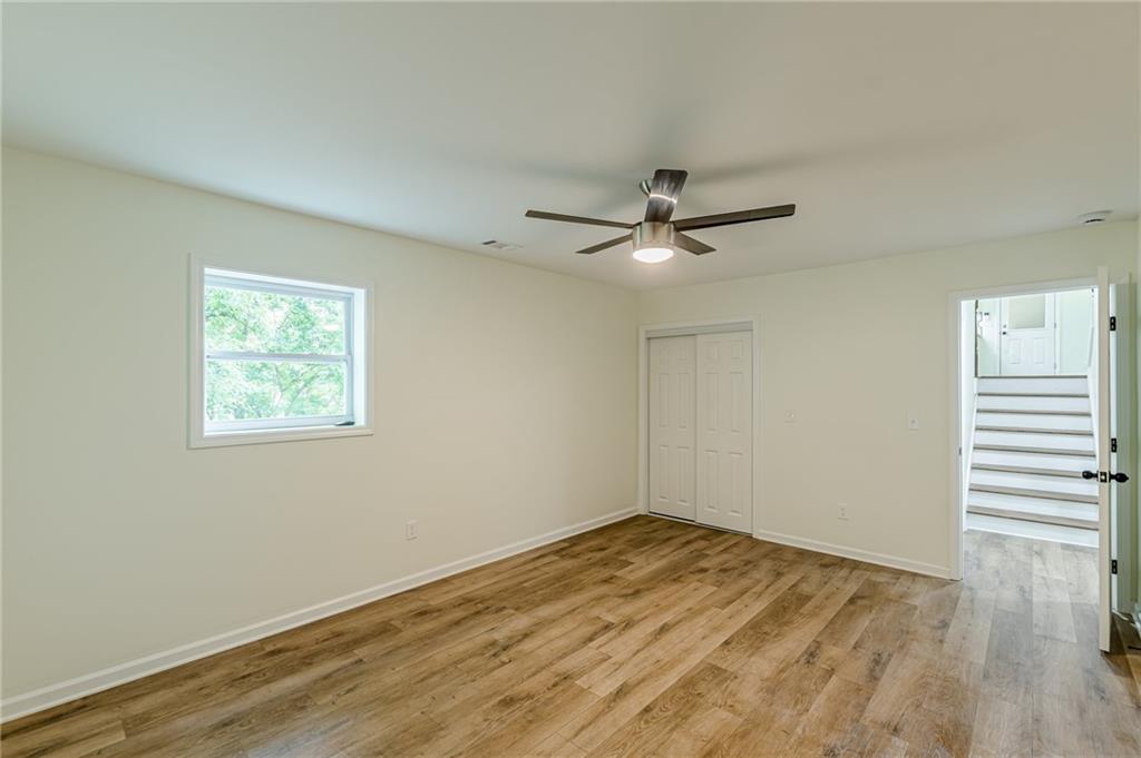 3275 Clifton Church Road Southeast Atlanta, GA 30316 - Photo 54 of 59 a view of a big room with wooden floor and a window