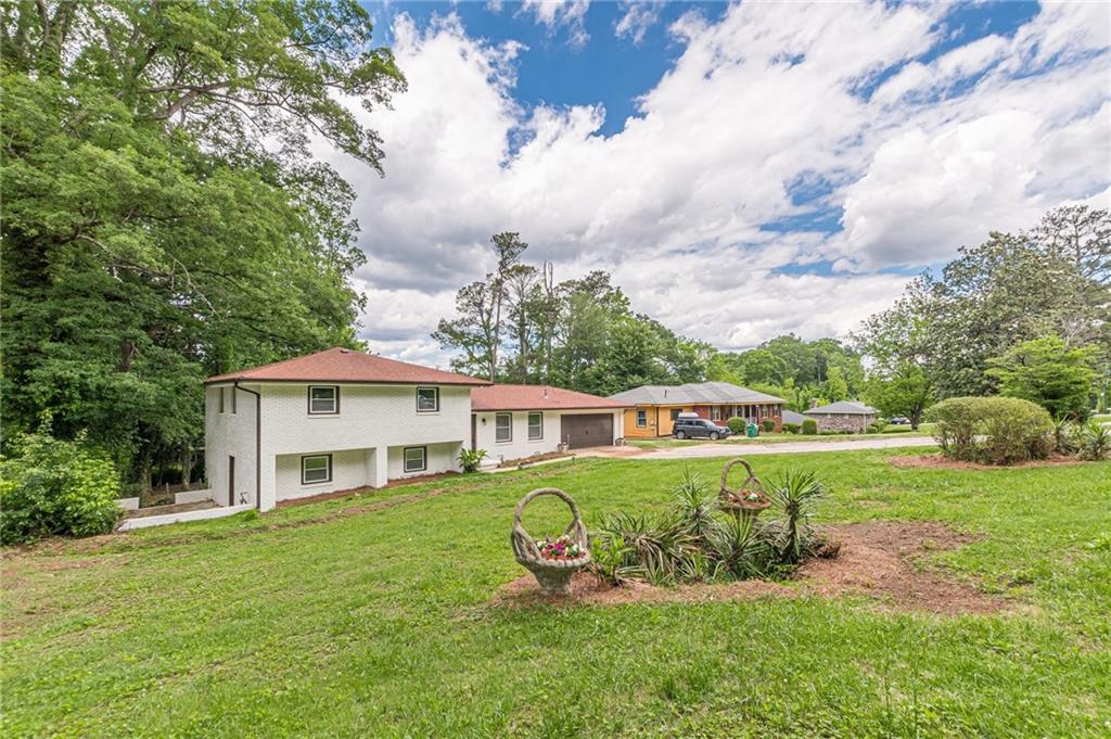 3275 Clifton Church Road Southeast Atlanta, GA 30316 - Photo 6 of 59 a view of a house with a yard