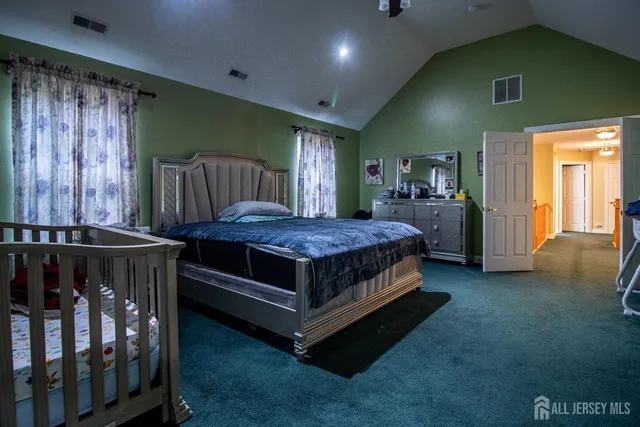 a bedroom with a bed and a walk in closet