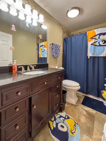 a bathroom with a sink a vanity and a mirror
