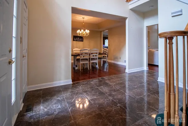 a view of a hallway with dining area