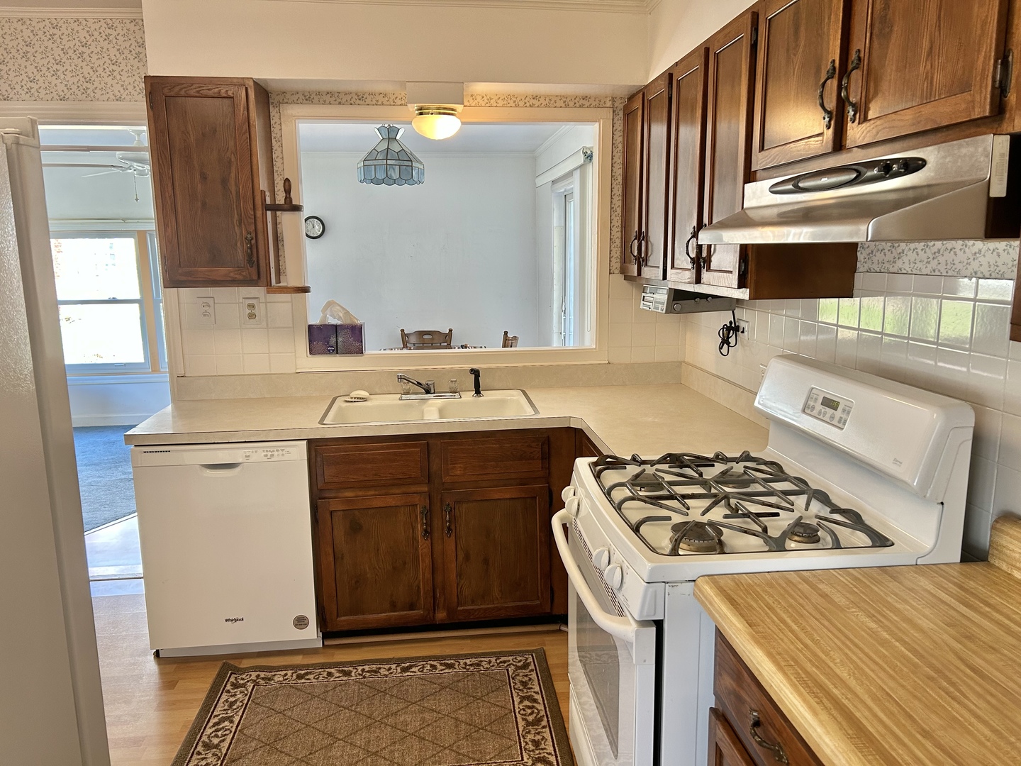 1119 Whitfield Road Northbrook, IL 60062 - Photo 4 of 17 a kitchen with a sink stove and cabinets