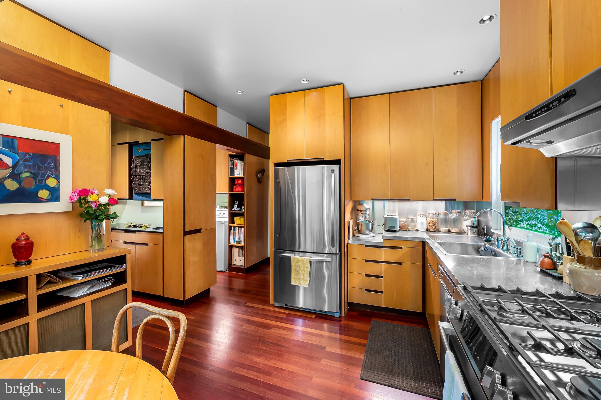 111 Deepdene Road Baltimore, MD 21210 - Photo 25 of 61 a kitchen with stainless steel appliances granite countertop a refrigerator stove top oven dining table and chairs