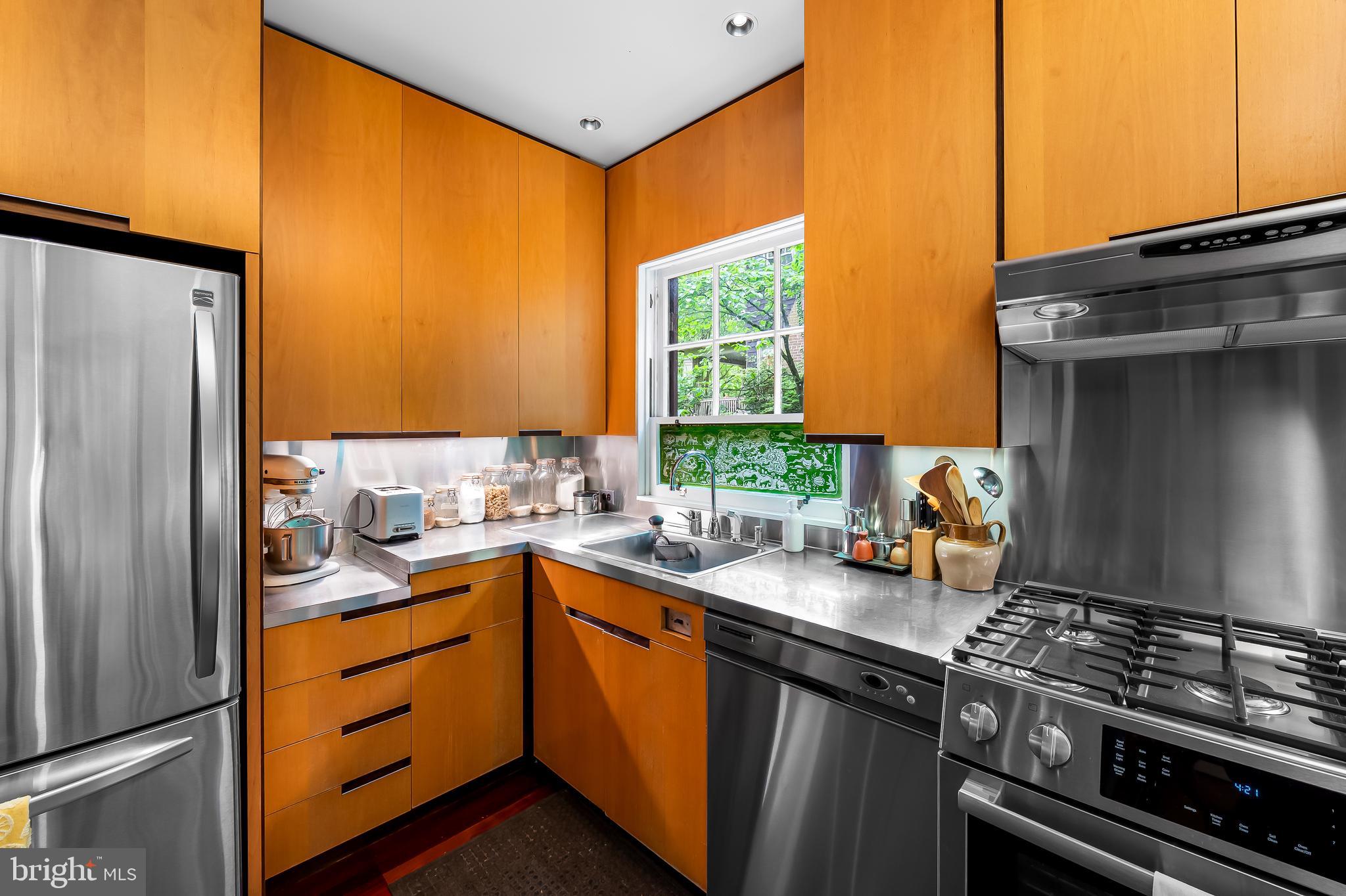 111 Deepdene Road Baltimore, MD 21210 - Photo 26 of 61 a kitchen with a sink a stove and cabinets
