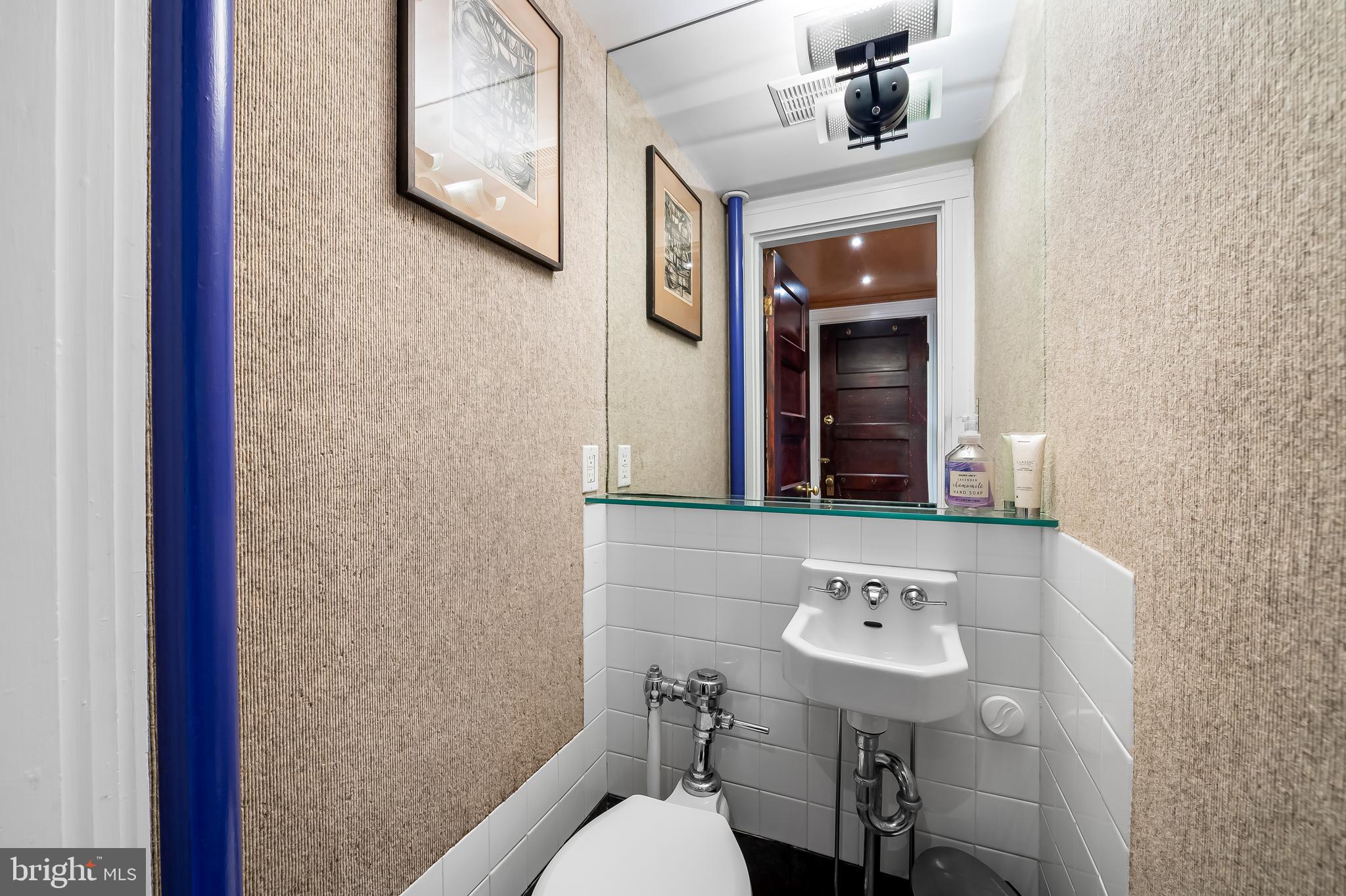 111 Deepdene Road Baltimore, MD 21210 - Photo 31 of 61 a bathroom with a sink and a mirror