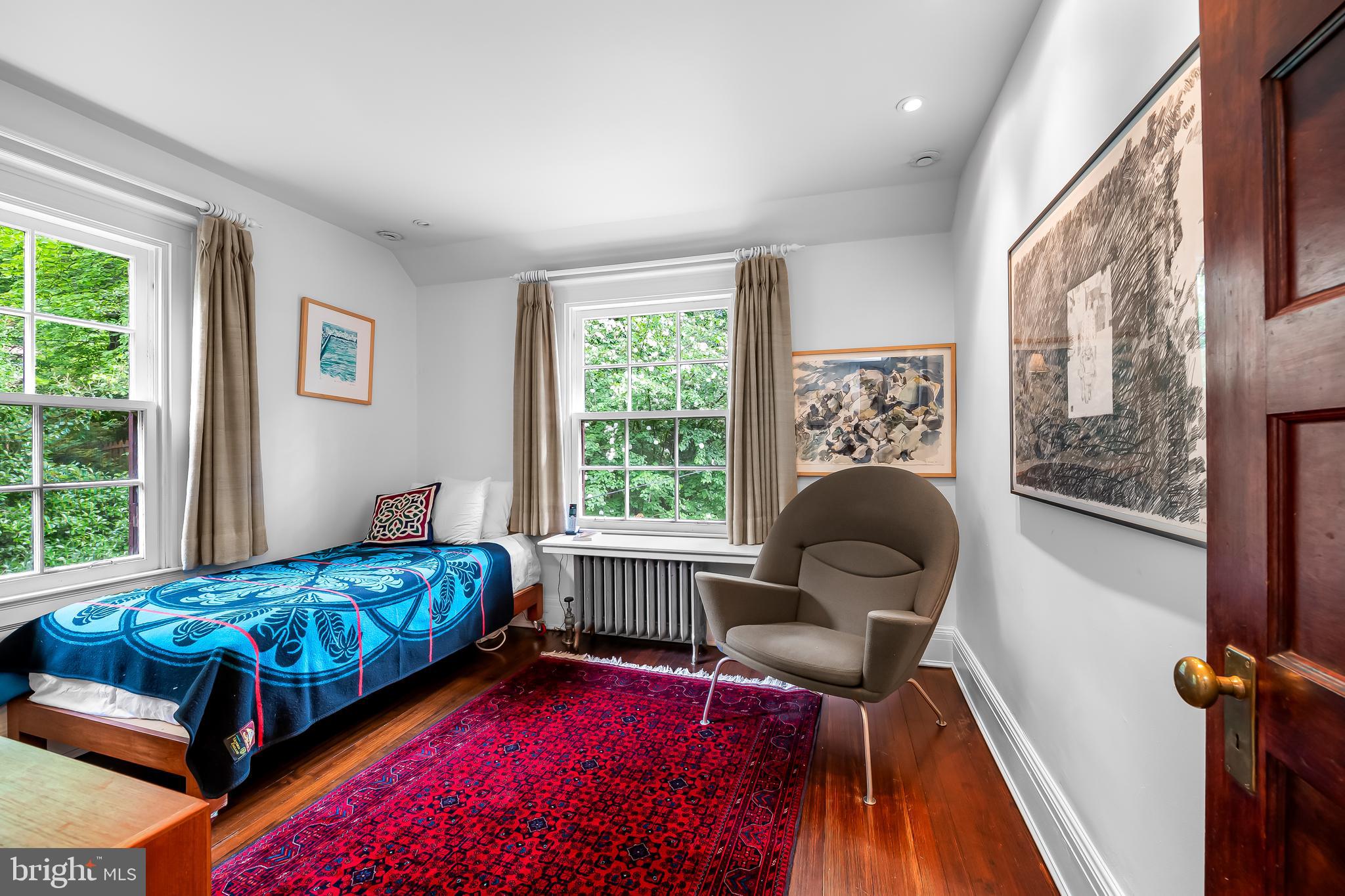 111 Deepdene Road Baltimore, MD 21210 - Photo 38 of 61 a bedroom with a bed and wooden floor