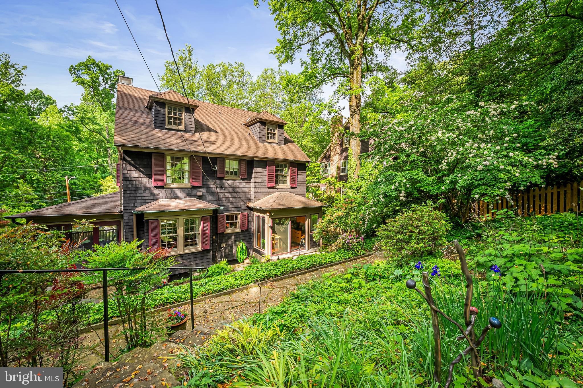 111 Deepdene Road Baltimore, MD 21210 - Photo 56 of 61 a front view of a house with a yard and potted plants