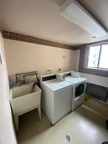 a utility room with washer and dryer