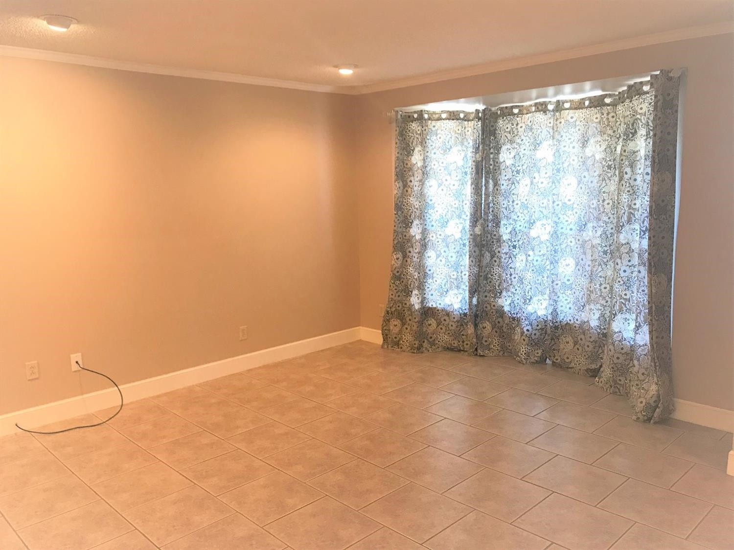 305 Ranch Street Ropesville, TX 79358 - Photo 2 of 10 a view of an empty room with a window