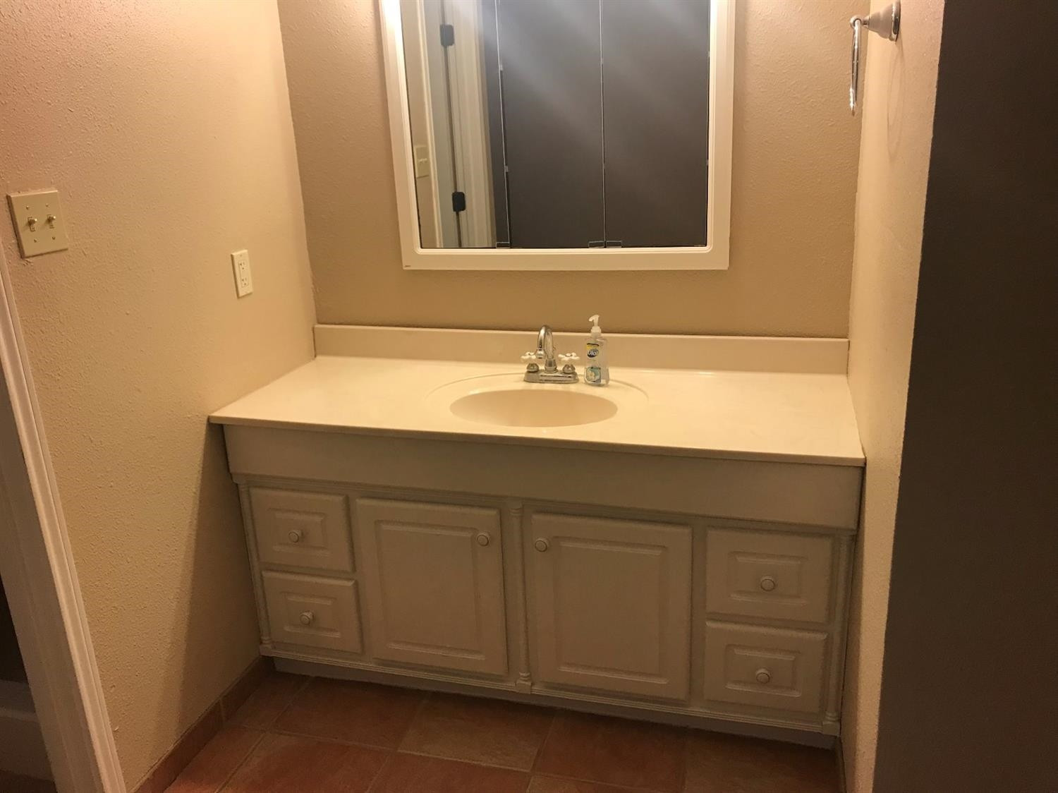 305 Ranch Street Ropesville, TX 79358 - Photo 9 of 10 a bathroom with a sink and a mirror