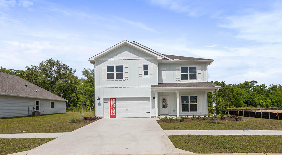 44 Oak Trees Lane West Freeport, FL 32439 - Photo 1 of 23 a front view of a house with a yard