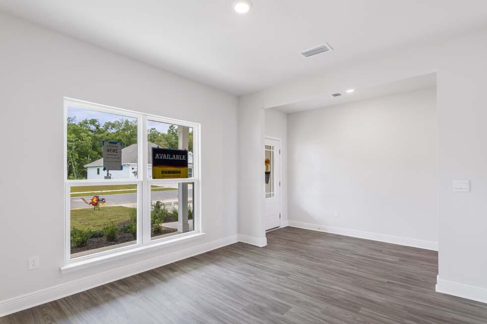 44 Oak Trees Lane West Freeport, FL 32439 - Photo 11 of 23 a view of an empty room with wooden floor and a window