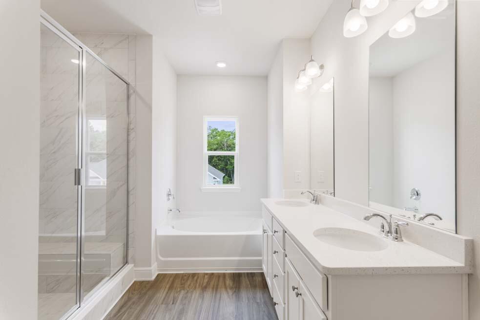 44 Oak Trees Lane West Freeport, FL 32439 - Photo 13 of 23 a bathroom with a double vanity sink mirror double and bathtub